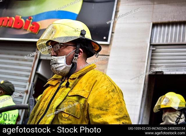 Firefighters help evacuate the buildings near as for several hours firefighters and other emergency services, including Colombia's red cross