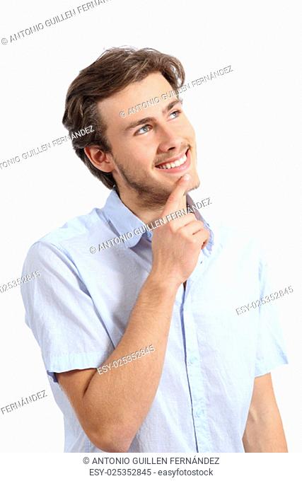 Young happy man thinking with hand on chin isolated on a white background