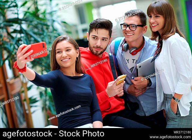 Selfie time international students with beaming smiles are posing for selfie shot