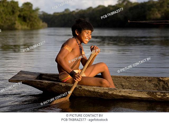 Portrait of a Xingu Indian in the Aamzone, Brazil Xingu indians love hunting in the forest and are good hunters They hunt for fish, wild pigs, birds, monkeys