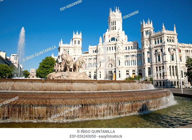 landmark of famous neoclassical sculpture monument fountain of greek goddess Cibeles in Madrid city Spain Europe, facade of public town hall building