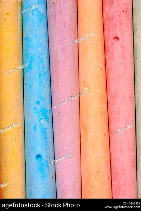 Close up of multicolored chalk sticks together