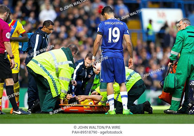Crystal Palace's Scott Dann (c) is treated after getting injured during the Premier League soccer match between FC Chelsea and Crystal Palace at the Stamford...