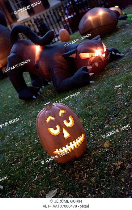 Illuminated jack-o-lantern and Halloween decorations