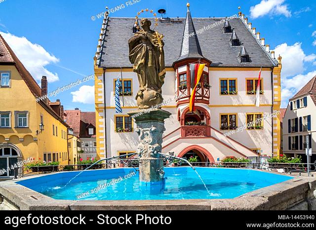 The historic old town of Volkach on the Main in Lower Franconia with town hall and fountain on the market square