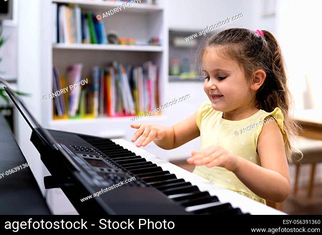 Child Girl Playing Music Keyboard Piano Instrument