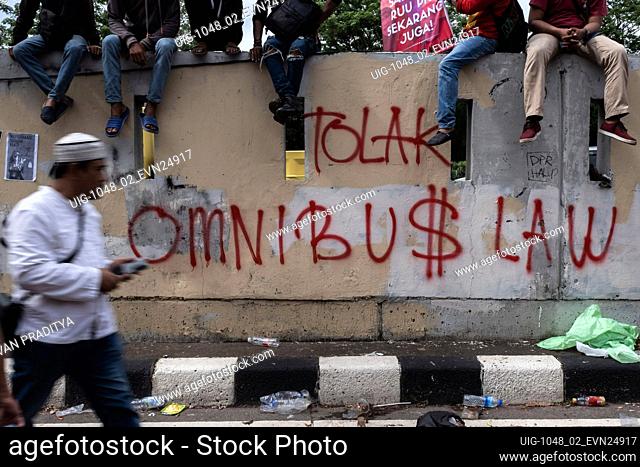Students and workers held a demonstration amid coronavirus pandemic, on the street in front of the House of Representatives building in Central Jakarta