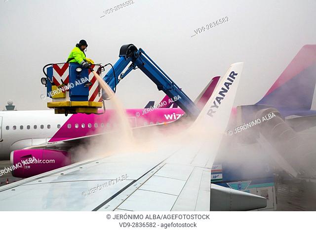 Clearing Ice And De-icing Aircraft. Budapest airport. Hungary, Southeast Europe