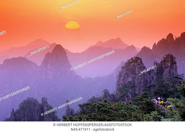 Sunrise, Chinese people, tourists are watching the sunrise. Huangshan mountains. China