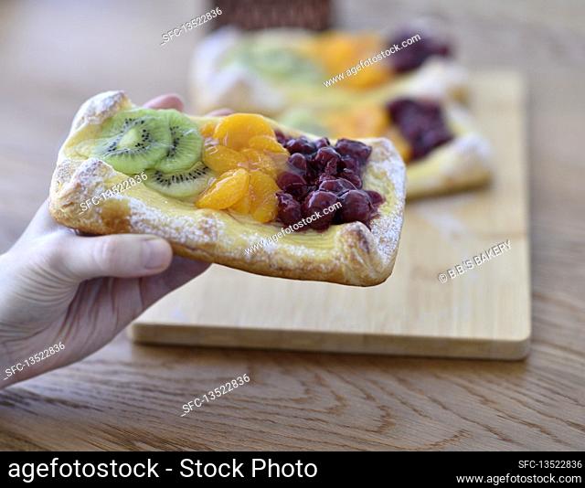 Vegan quark puff pastry with kiwi, mandarin oranges and cherries