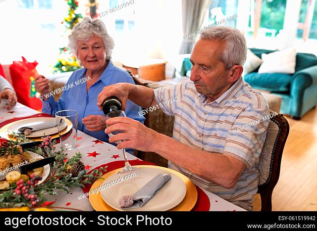 Senior caucasian couple sitting at table for dinner together