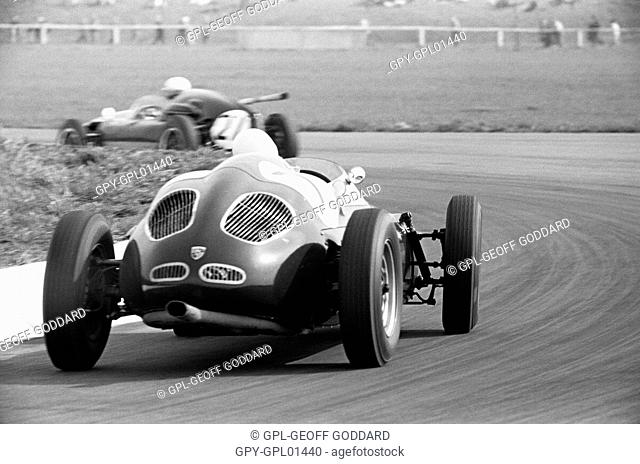 Stirling Moss in Walker-entered Porsche chasing Jack Lewis in the Cooper T45-Climax, XV BARC 200 race which Moss won. Aintree, England 30 April 1960