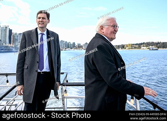 25 April 2023, Canada, Vancouver: German President Frank-Walter Steinmeier (r) and David Eby, Premier of the Province of British Columbia, on a harbor tour