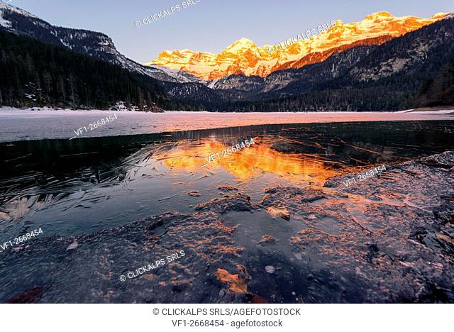 Sunrise Tovels lake on a cold winter day, Natural Park Adamello Brenta, Non valley, Trentino Alto Adige, Italy