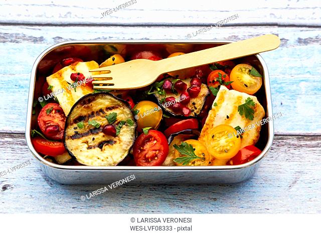 Persian tomato salad with halloumi in metal lunch box