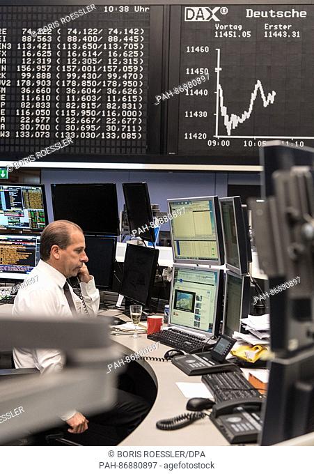 A stockbroker at work in the trading room of the stockmarket in Frankfurt am Main, Germany, 30 December 2016. Stockbrokers celebrated the last day of trading of...