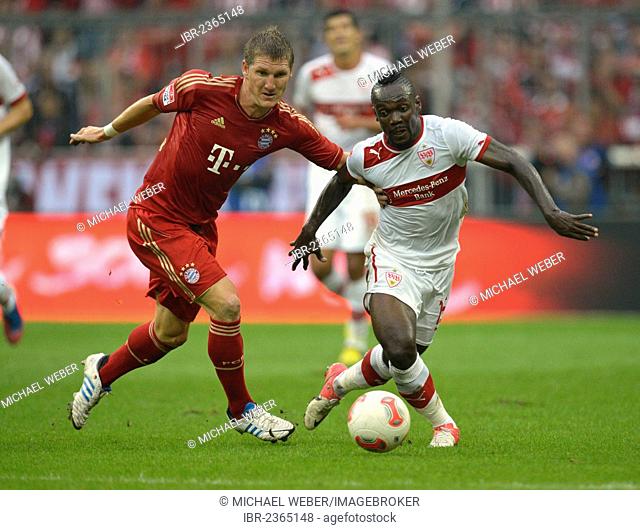 Arthur Boka of VfB Stuttgart, right, in a duel with Bastian Schweinsteiger of FC Bayern Munich, left, Allianz Arena, Munich, Bavaria, Germany, Europe