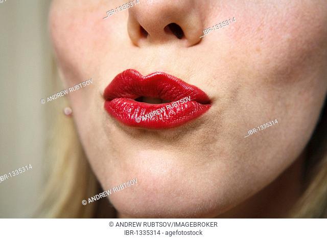 Young woman puckering lips