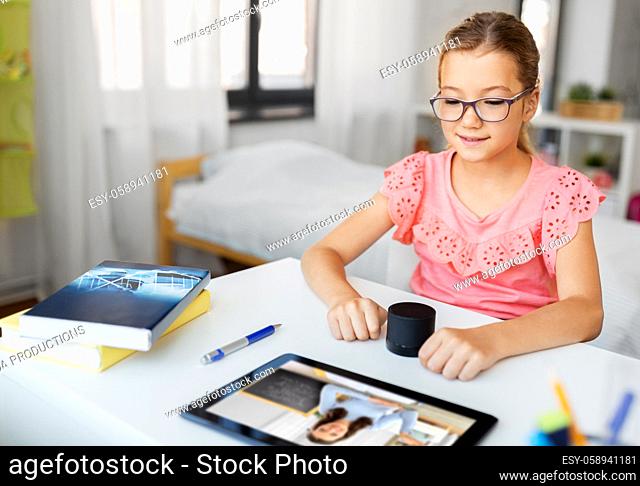 girl with smart speaker learning online at home