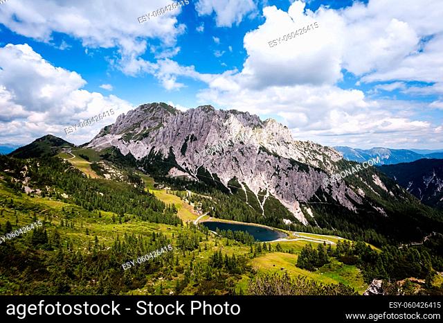 High angle panoramic view of the Julian alps in summer, as seen from passo Pramollo on the border between Italy and Austria. Mountain Landscape