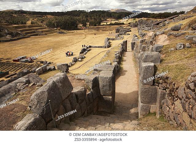 Visitors at the The Saqsaywaman archaeological complex, a massive fortress of the Incas, overlooking the Inca navel of Cusco, Peru, South America