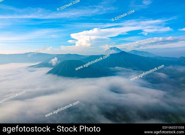 Indonesia. Morning in the Bromo Tengger Semeru National Park. Dense fog in the valley
