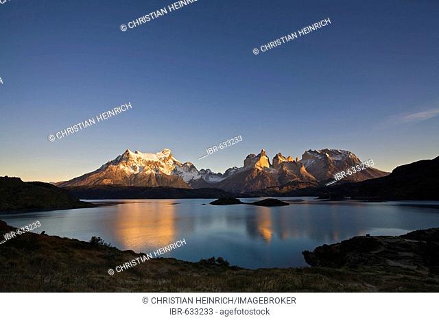 First warm light at the Torres del Paine massifat the lake Lago Pehoe, national park Torres del Paine, Patagonia, Chlie, South America