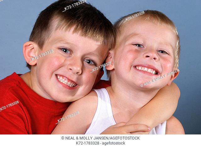 Young brothers smiling and posing for the picture