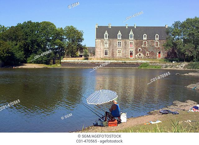 Comper castle by Vivian's Lake and fisherman, forest of Brocéliande (aka forest of Paimpont). Brittany, France