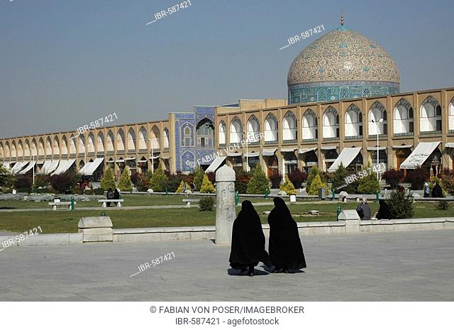 Two veiled women in front of Sheikh Lotf Allah Mosque at Meidan-e Imam (Imam Square), Isfahan, Iran