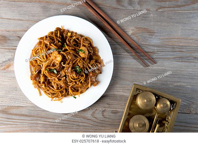 Fried Penang Char Kuey Teow which is a popular noodle dish in Malaysia, Indonesia, Brunei and Singapore.