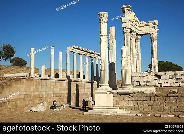Visitors in front of the marble columns and rests of The Sanctuary of Trajan at Bergama Archaeological site of ancient Pergamon city, Bergama Town