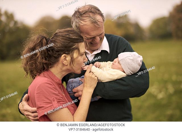 couple, baby, family, age difference, outdoors, in park, generations, Grandfather, mother, at Neuhofener Berg, Munich, Germany
