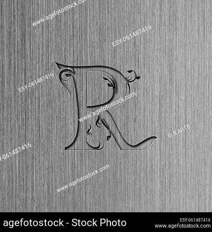 Macro shot of brushed steel with the letter R, metal texture background