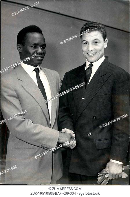 May 05, 1951 - Hamia-Bassey For World Feather Weight Title. OPS: Cherif Hamia, North African French Boxer (Left) and the black American Champion Kid Hogan...