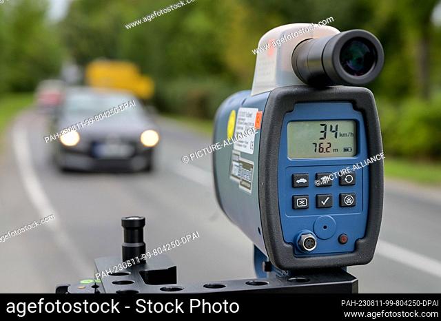 11 August 2023, Saxony-Anhalt, Zörbig: A police speedometer shows the speed of a passing car. The Saxony-Anhalt police are taking part in the Europe-wide...