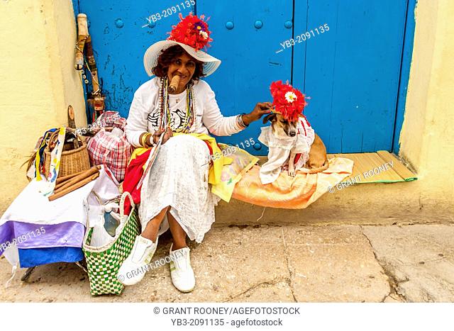 Cuban Woman With Her Dog Posing For Photographs, Havana, Cuba