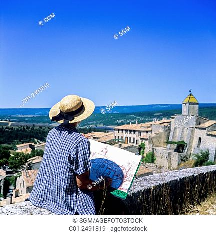 Middle aged woman drawing Aurel perched village, Vaucluse, Provence, France