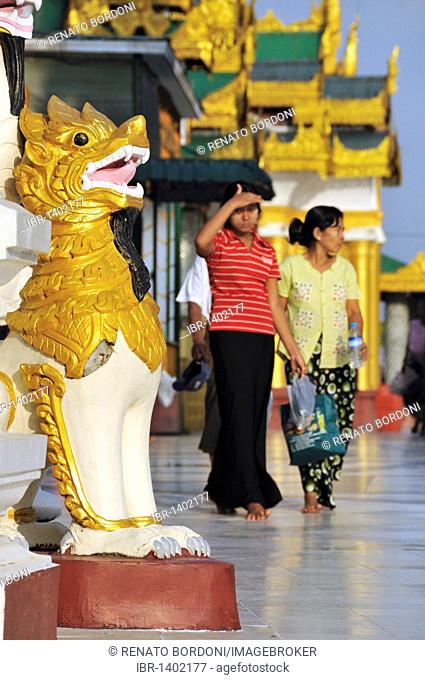 Mythical lion, Chinthe, visitors of the Shwedagon Pagoda, Yangon, Burma, Myanmar, Southeast Asia