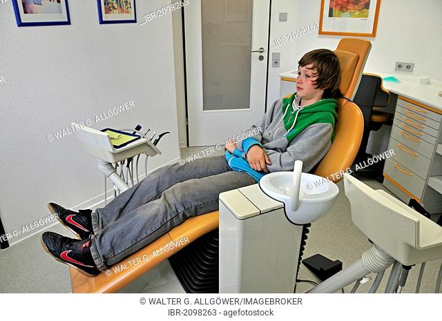 Boy, 11 years, waiting for the treatment at the dentists