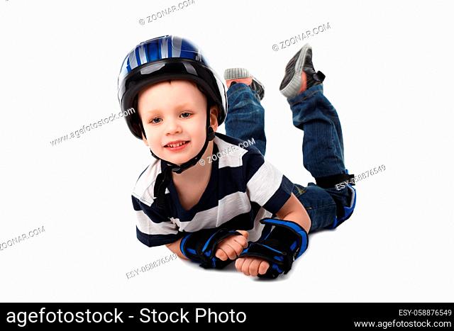 llittle boy in protective gear fell off his bicycle or scooter or skateboard or roller-skates isolated on white background