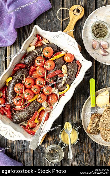 Black pudding baked with pepper and tomatoes