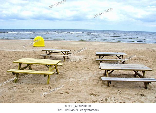 summer season cafe tables on sea beach sand