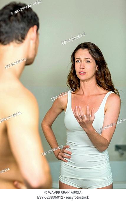 Sad woman talking to man