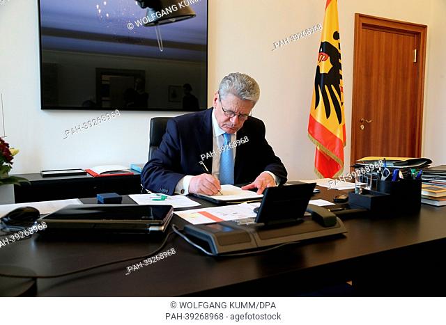 German President Joachim Gauck sits in his office at Bellevue Palace in Berlin, Germany, 06 May 2013. Behind him hangs the painting 'A.D