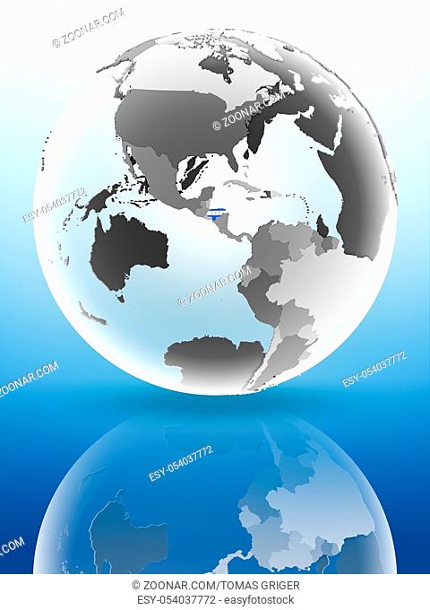 Honduras with flag on globe reflecting on shiny surface. 3D illustration