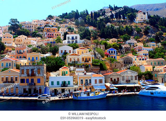 Historic Simi island houses and boats in Grece