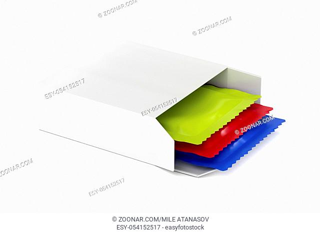 White cardboard box with three condoms on white background