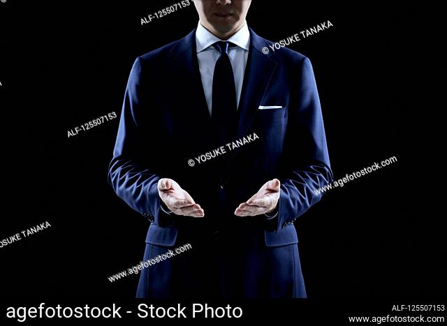 Businessman on black background