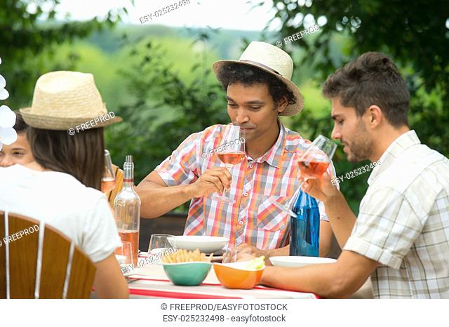 Group of Friends Enjoying Drink, Outdoor, serving rose wine